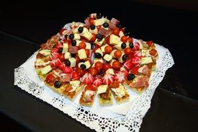 snack plate with canapes radishes