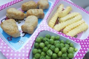 fries, green peas, nuggets in lunch box