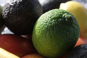 lime, avocado and lemon in a box