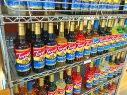 Flavored syrups on racks in the store