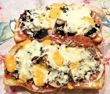 slices of bread with sausage and cheese