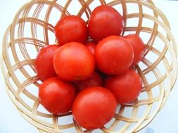 red tomatoes in a basket
