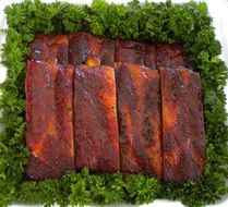 pork ribs on a green salad