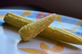yellow baby corns on a plate