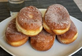 fresh donuts on a white plate