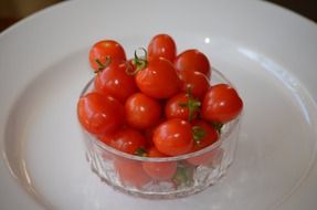 cherry tomatoes in glass bowl