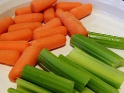 young carrots and celery stalk