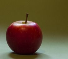 red apple with a tail close-up