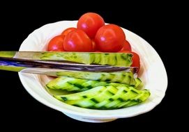 tomatoes and cucumbers on a plate