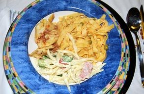 noodles with salad on a bright plate