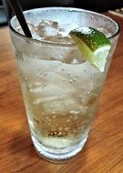 ginger drink with ice in glass