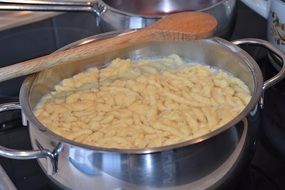 Noodles in the pan on the stove