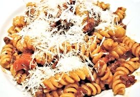 fusilli pasta with meat sauce and cheese