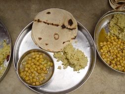 mid day indian meal on metal plates