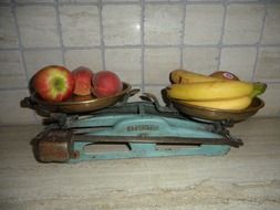 weighing fruit on old scales