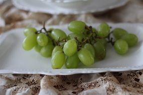 green grapes on a plastic plate