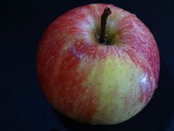 Drops of water on an apple fruit