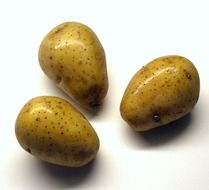 three washed potatoes