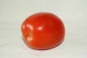 Photo of small red tomato