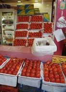 red tomatoes and other stuff at grocery store in Mumbai, India