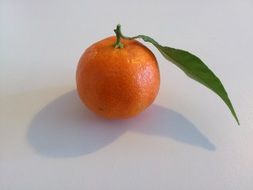 mandarin with a green leaf