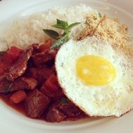fried eggs with meat and rice