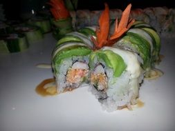 a lot of japanese sushi on a plate