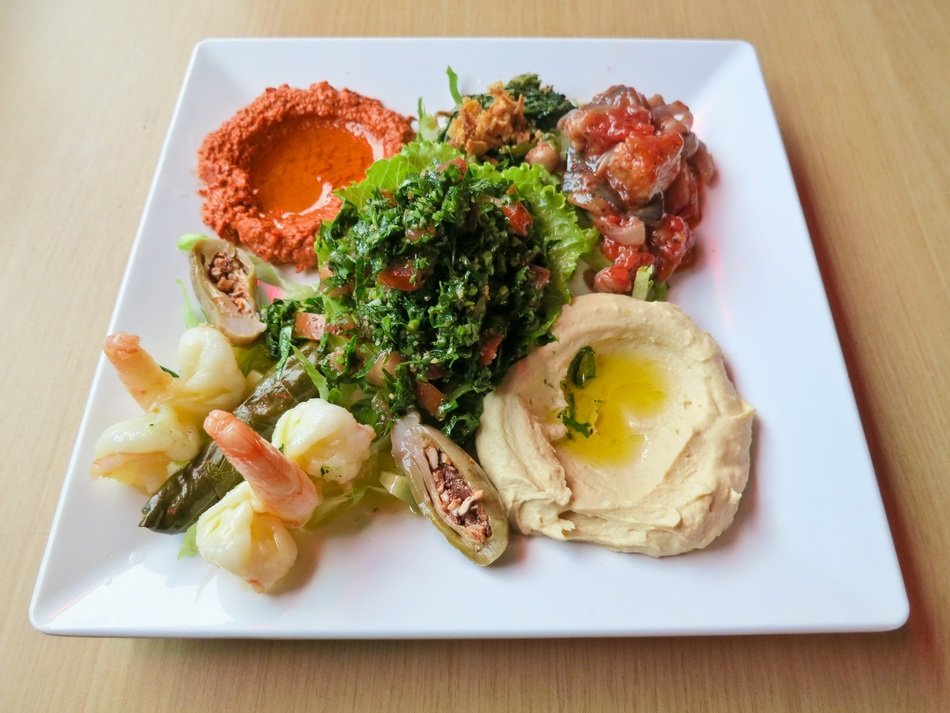 hummus and magdous on a white plate