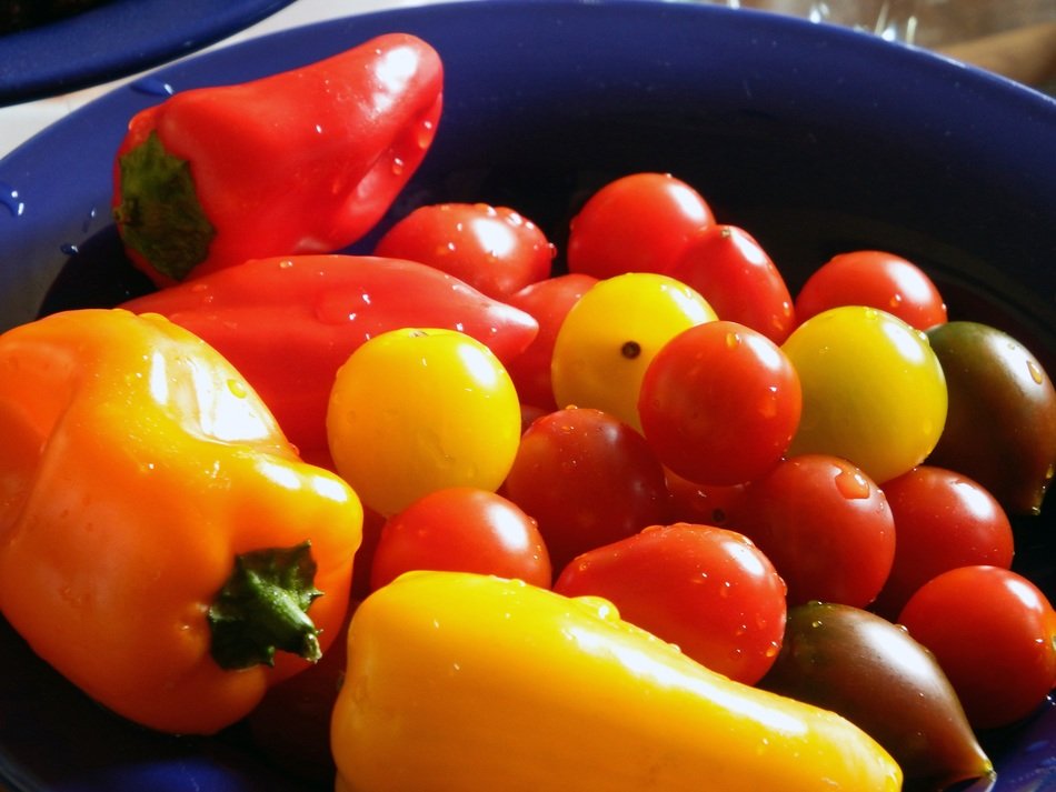 vegetables are washed in a basin