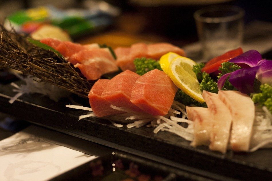 japanese dish with fish on a black plate