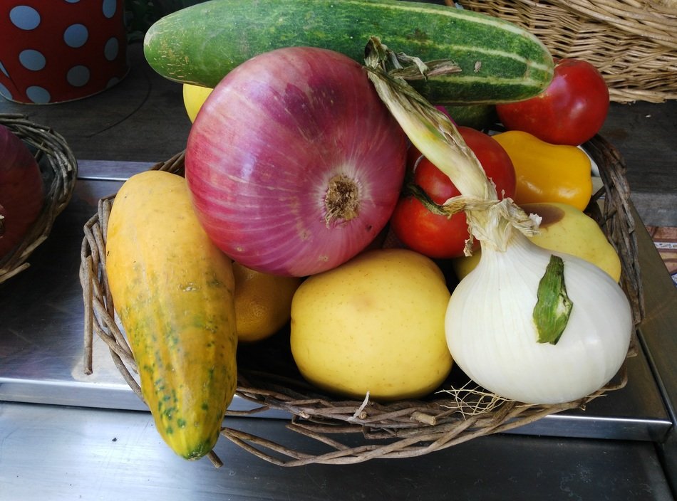 apple cucumber onion tomato in basket