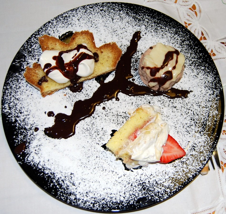 Italian cakes with icing sugar on a dish