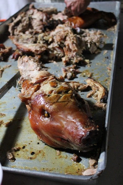 head and bones of fried suckling pig on pan