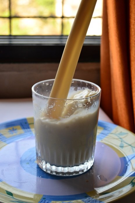 milk pours into the glass