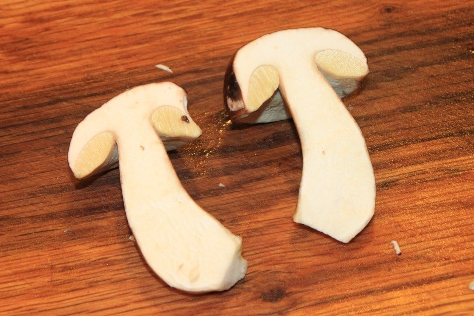 Sliced mushroom on wooden boards