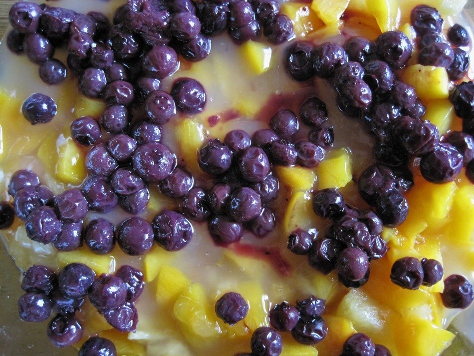 peaches and blueberries on the dessert