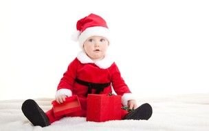 Kid in red suit of Santa Claus