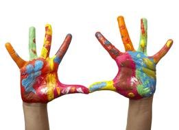 Close Up Of Child Hands Painted With Watercolors On White Background
