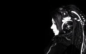 girl in headphones on a black background as a picture for a clipart