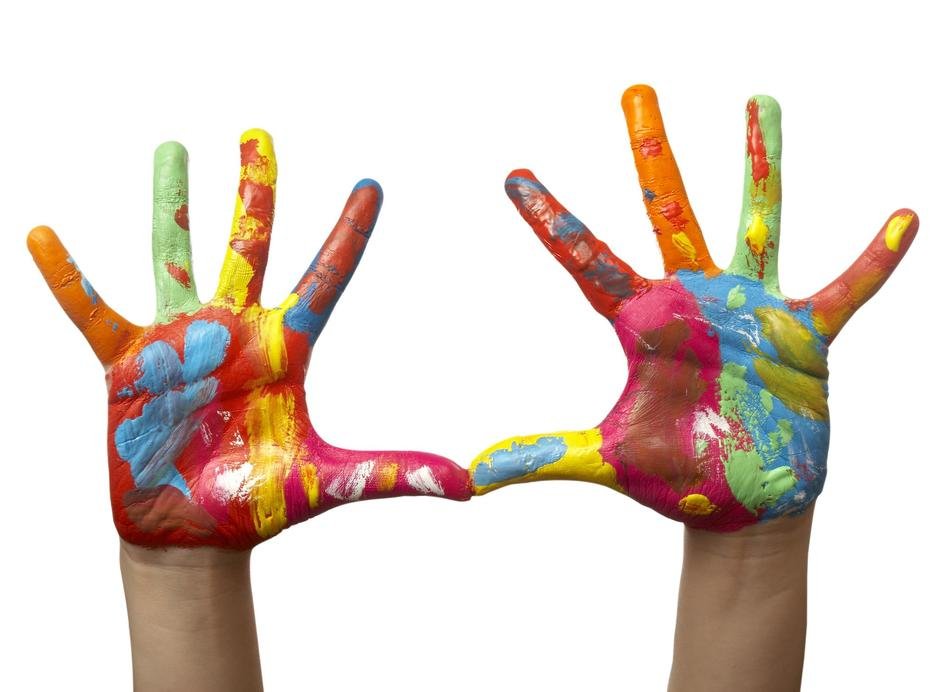 Close Up Of Child Hands Painted With Watercolors On White Background