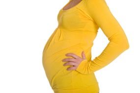 Baby Peeking Out Maternity Clothes
