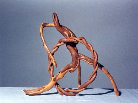 abstract wood sculpture on a white table