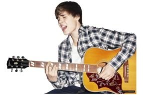 Justin Bieber is singing and playing with the guitar