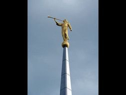 golden statue on the column