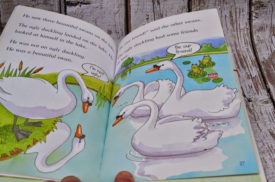 open book with a tale of swans