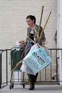 Actress Alyson Hannigan With Garden Tools