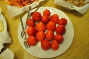 red strawberry dessert on white plate