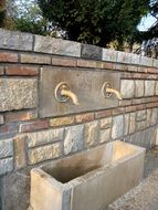 stone drinking water fountain in park