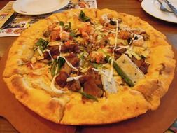 hot pizza with meat and vegetables