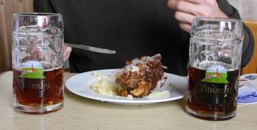 beer drink and meal on plate